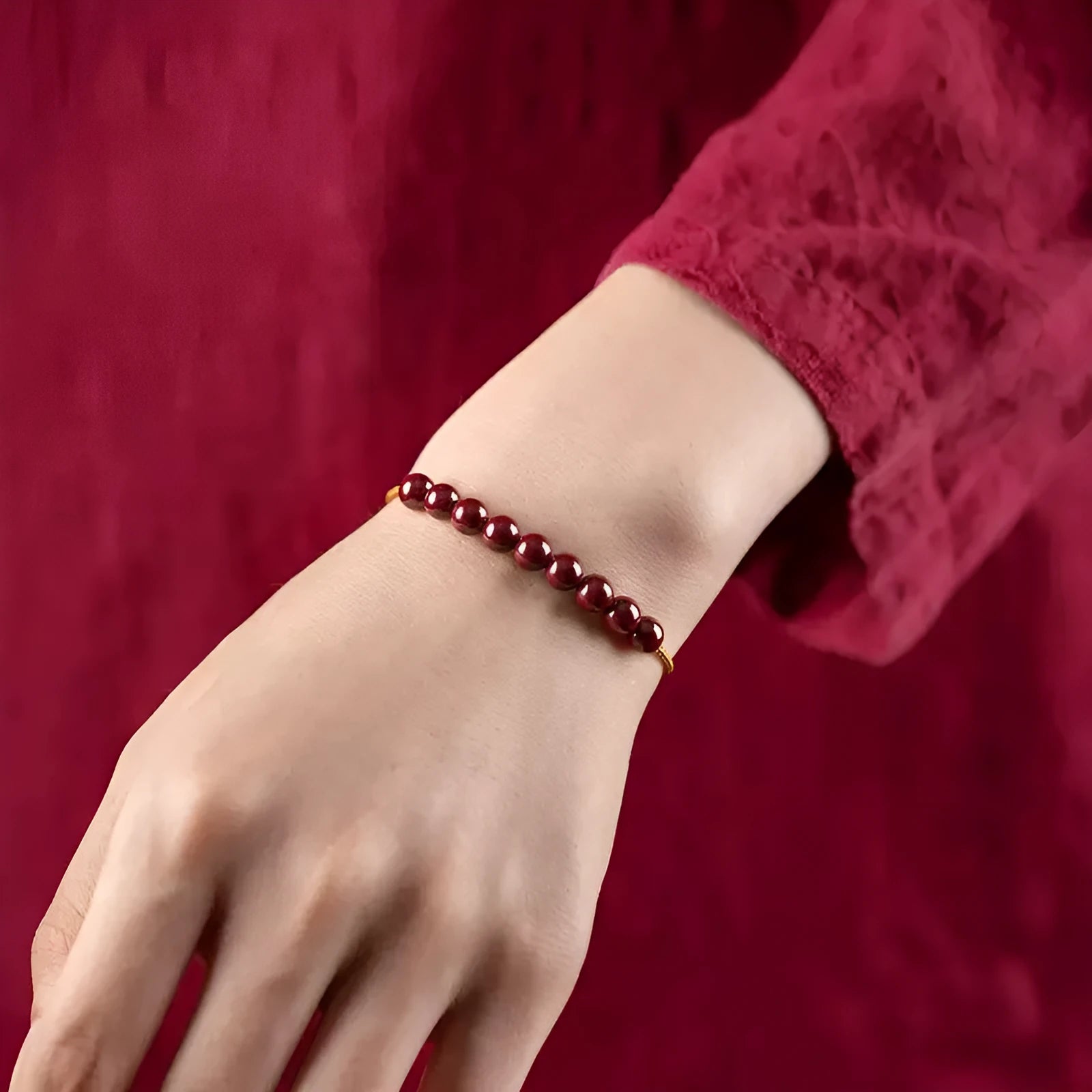 Hand-woven cinnabar and Hetian jade geometric bracelet on display