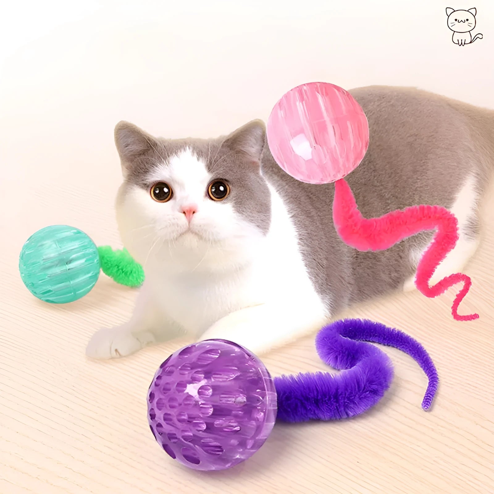 Interactive cat ball toy with plush tail in green, pink, and purple on white background