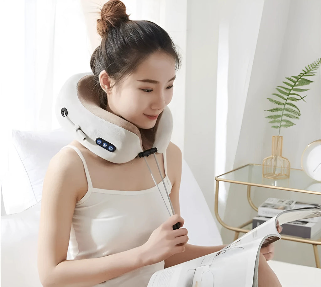 Brown U-shaped electric neck massager pillow on a grey background