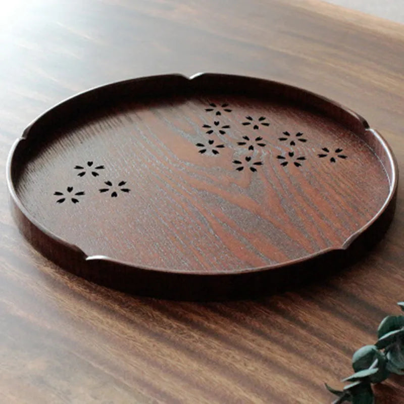 Wooden shallow plate with 12-hole sakura blossom pattern, 30 cm diameter.
