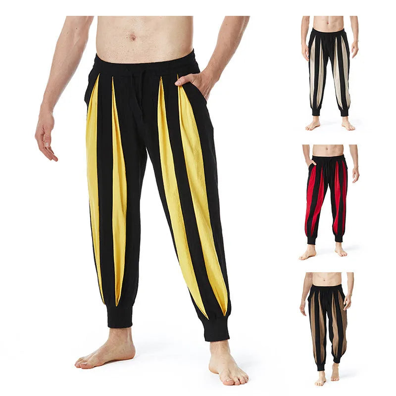 Man wearing straight-leg casual trousers in one of four available colours: brown, khaki, red, or yellow.