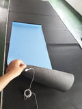Blue yoga mat with plants pattern and a black grounding wire attached.