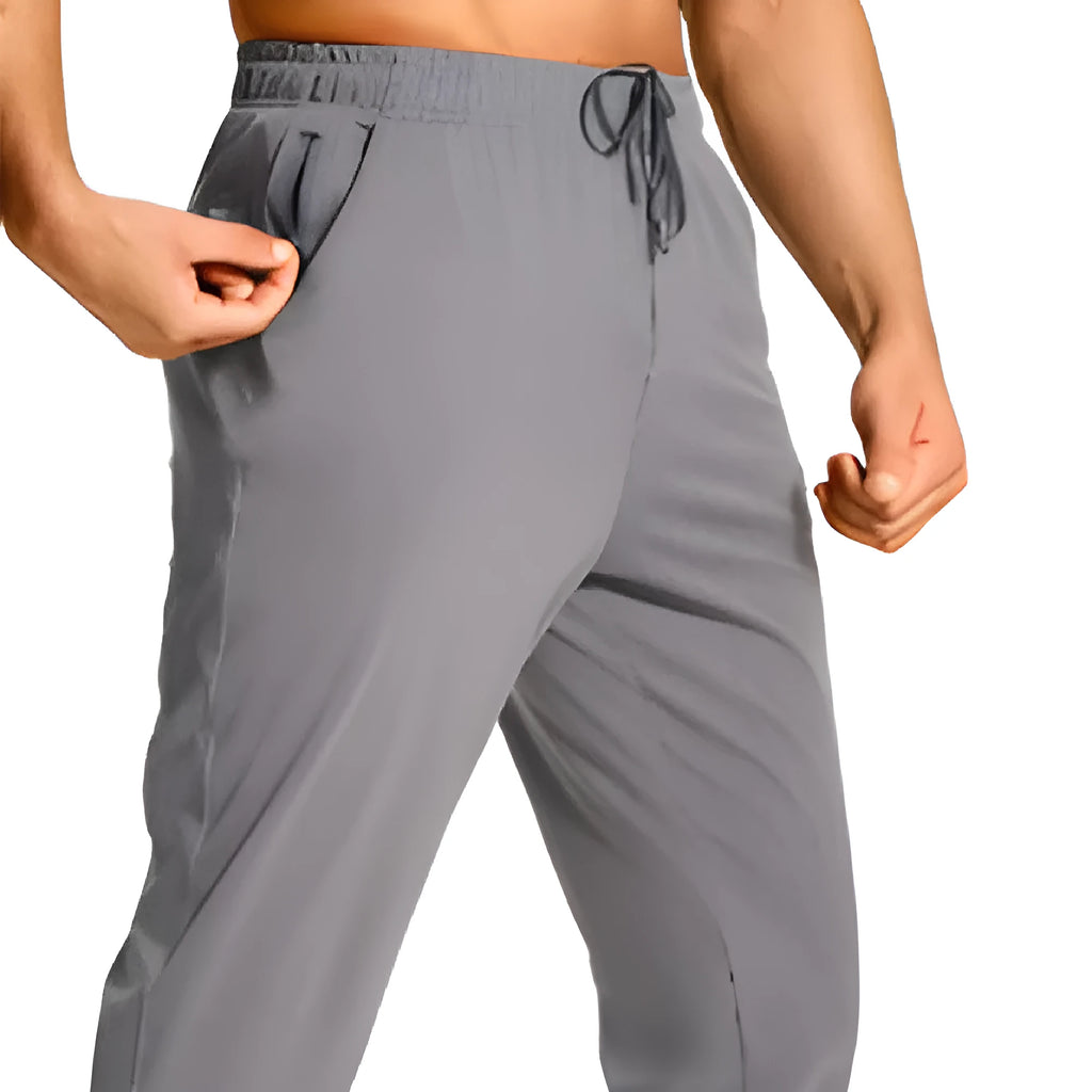 Men's loose fit casual trousers in solid colour made from polyester fabric