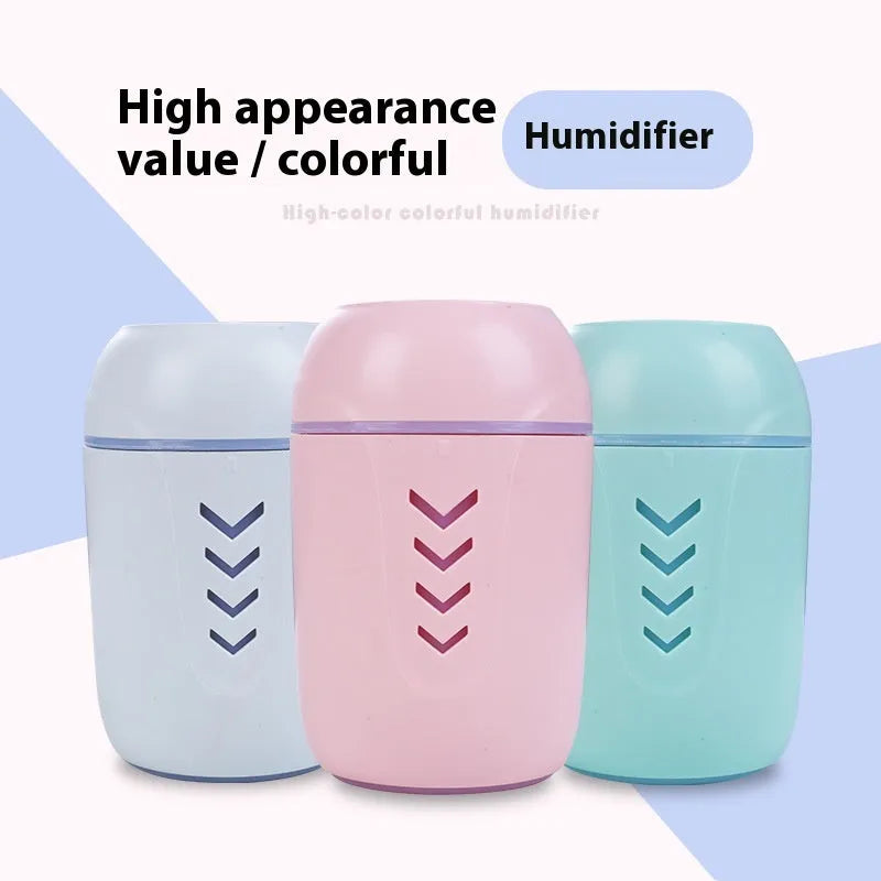 Round desktop air purifier with aromatherapy in blue, showing single fog outlet and USB cable