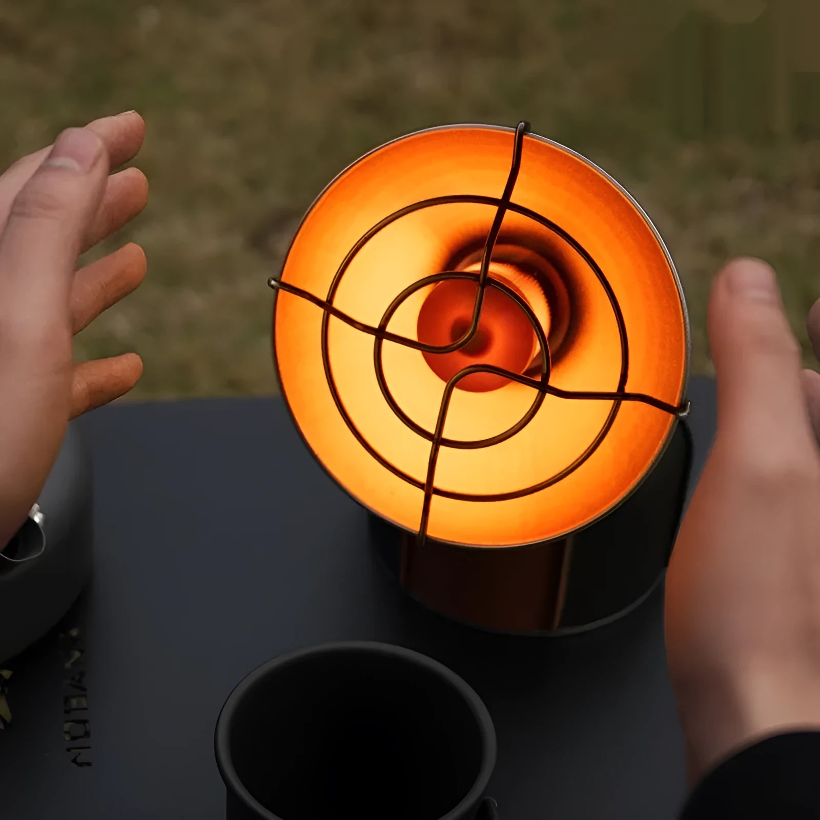 Black and orange portable camping heating stove with automatic ignition