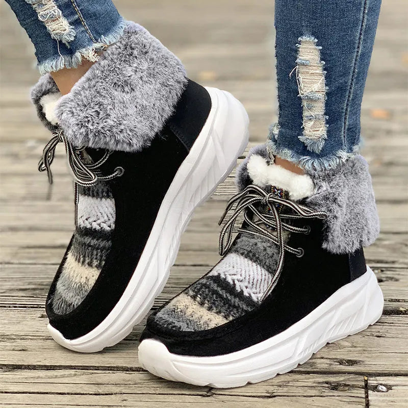 Beige women's lace-up suede snow boots with thermal lining and a thick rubber sole.