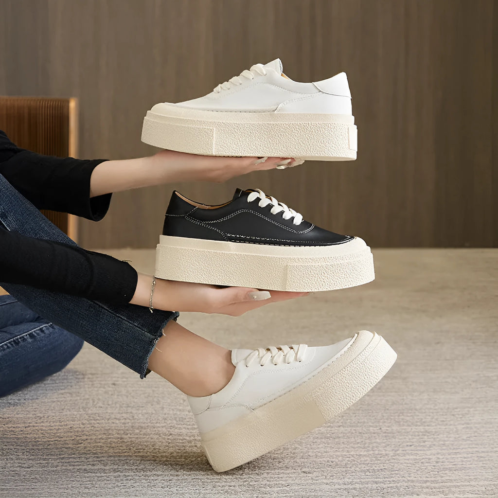 Women's tied platform sports board shoes in black with round toe, cowhide upper, and rubber sole