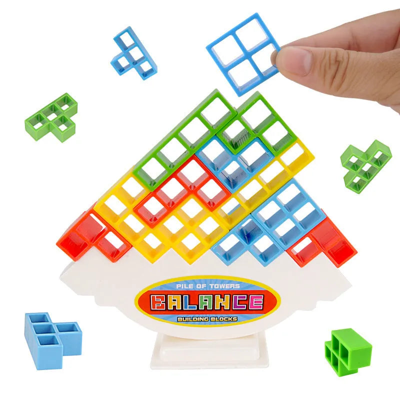 Plastic balance stacking game with 16 coloured blocks, chassis and base on a table