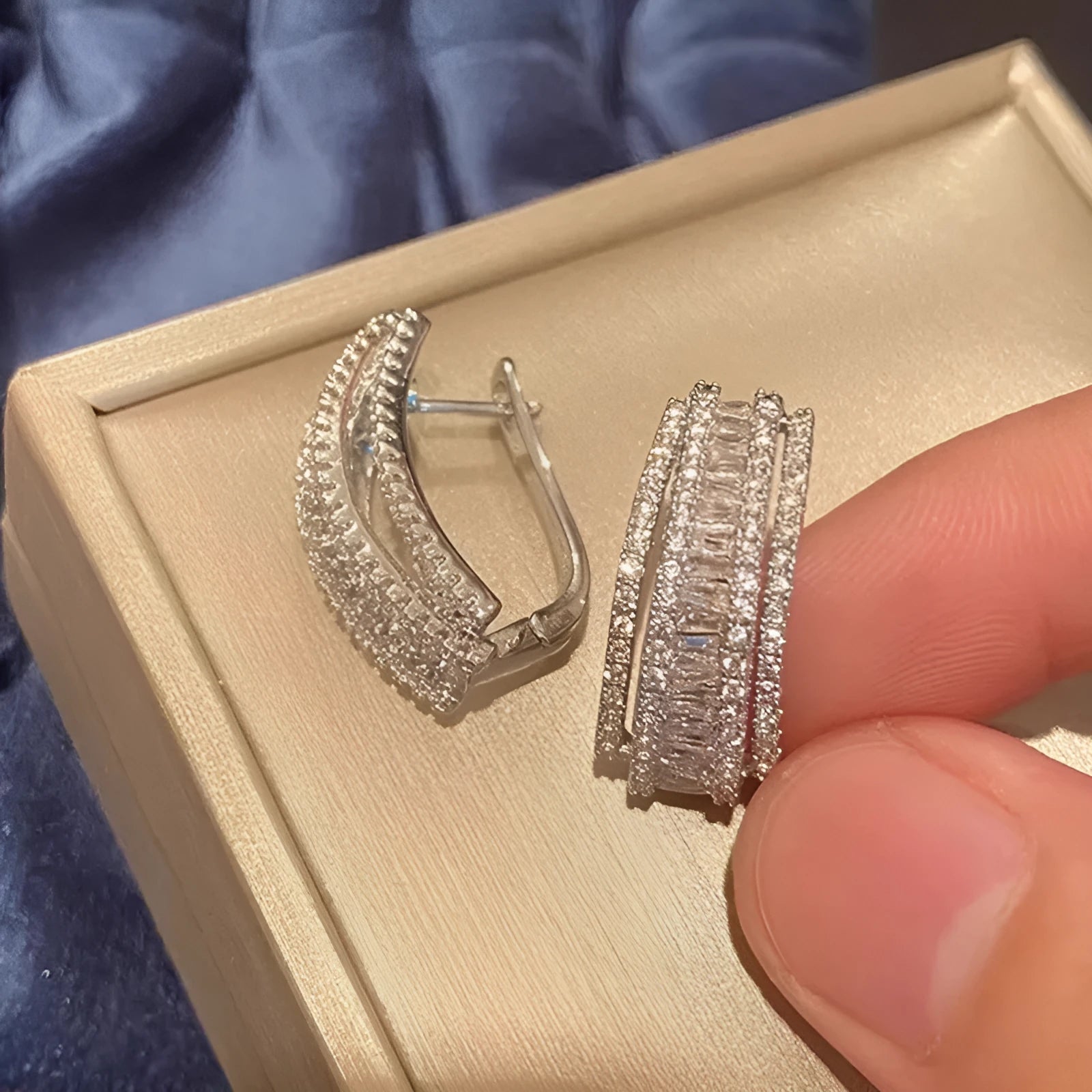Geometric shaped white gold colour stud earrings with inlaid zircon stone for women.