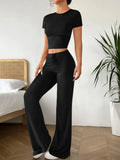 Black high waist trousers and short sleeve t-shirt co-ord set on hanger