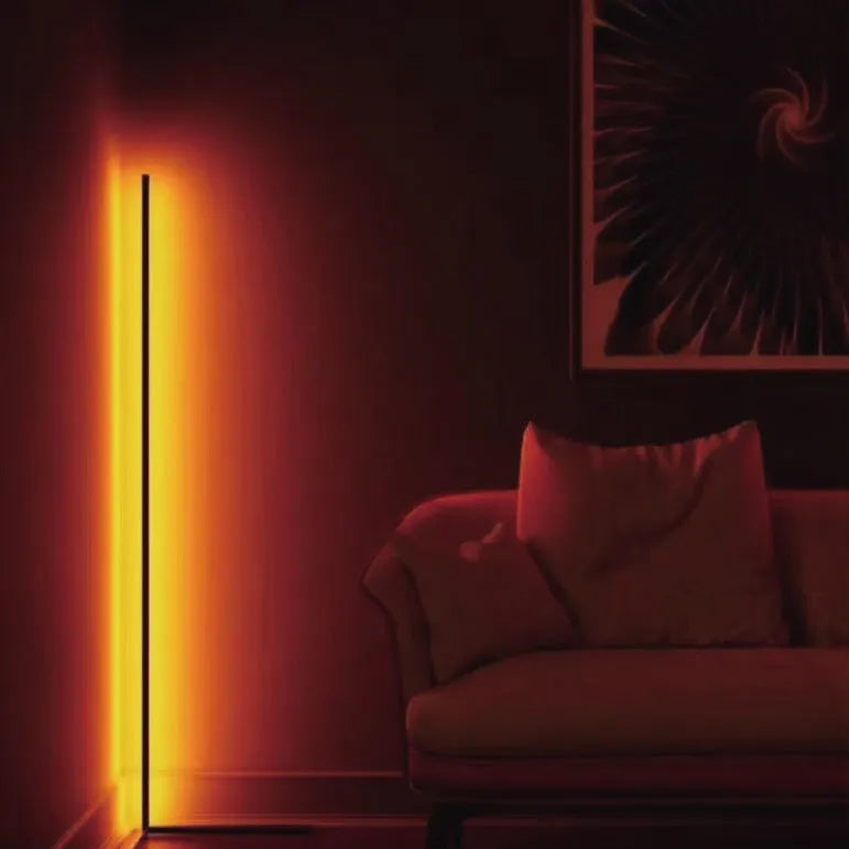 Black smart floor lamp with aluminium body and silicone shade, showing remote control