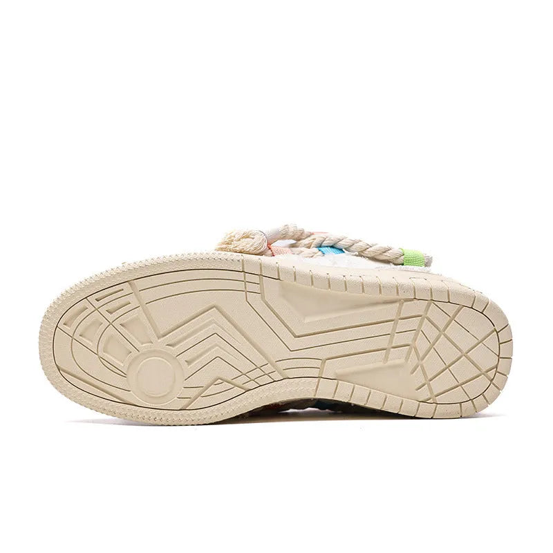 Old Damage brand creamy white retro skate shoes with low platform heel and lace-up front.