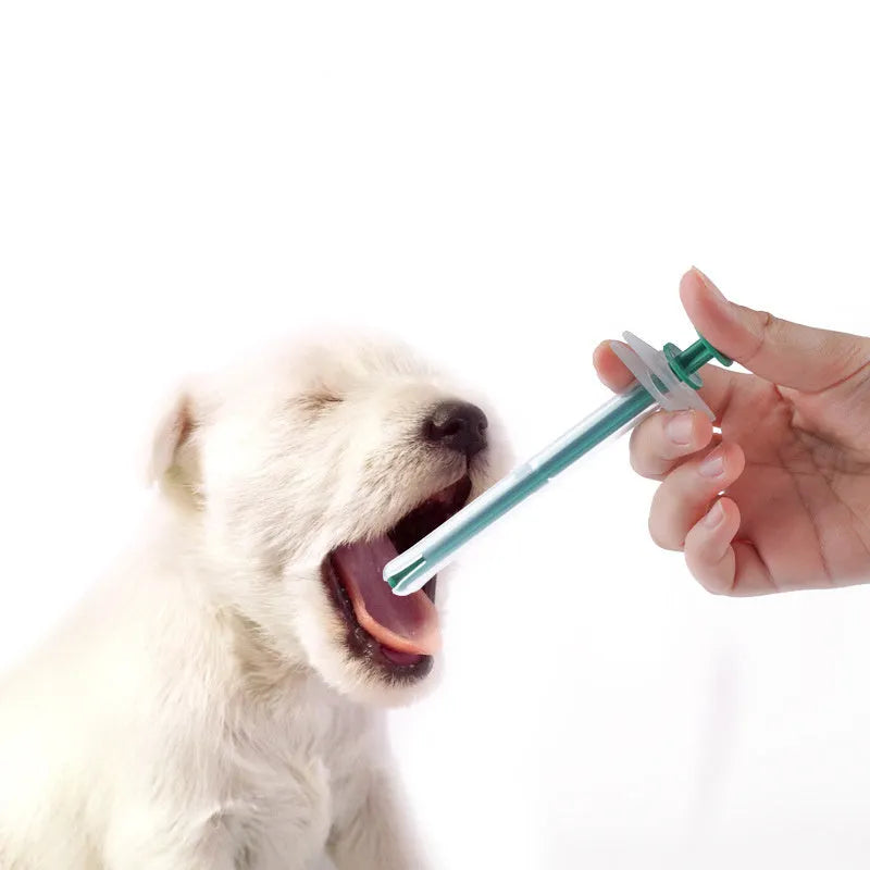Two silicone pet pill shooters with soft tips for administering medication to cats and dogs