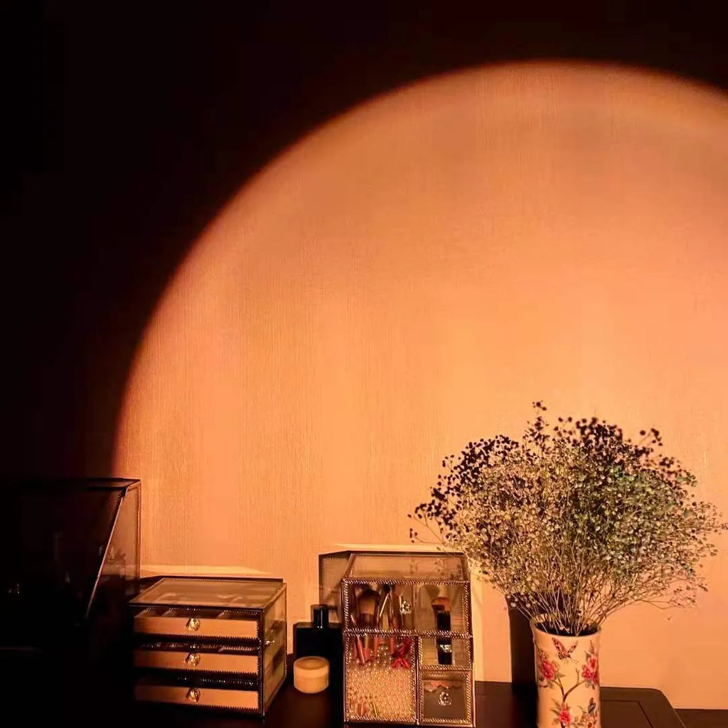 Rechargeable sunset projection lamp with USB cable showing rainbow and red light effect.