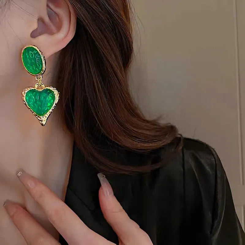Silver needle pleated oval love heart stud earrings in purple, red, green, and yellow/white alloy colours.