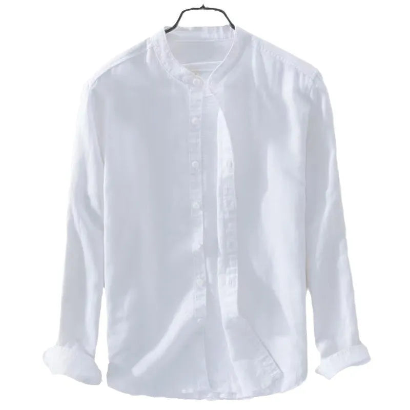 Man wearing a loose-fit light blue linen blend long sleeve casual shirt.