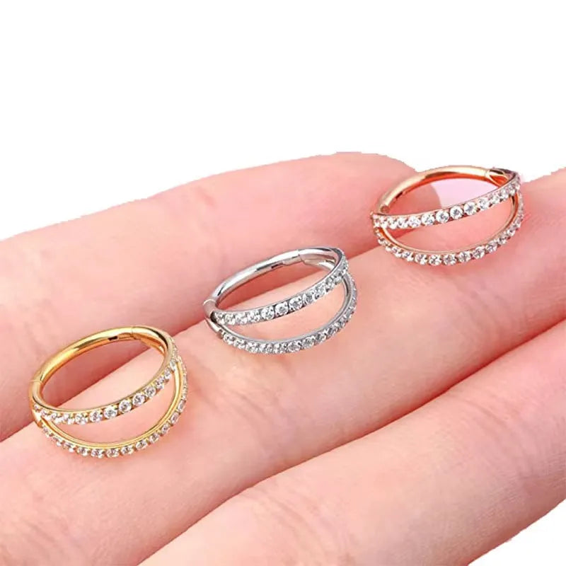 G23 titanium alloy puncture-style lip and nose ring in steel colour or gold finish.
