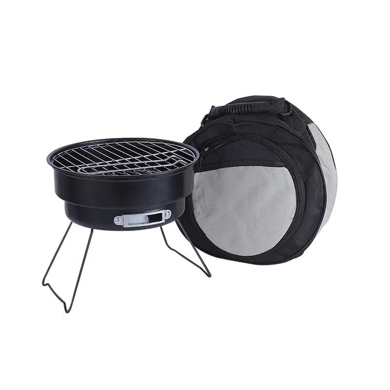 Small portable folding round ice stove barbecue grill set with mesh, legs, and clip on a grey background.