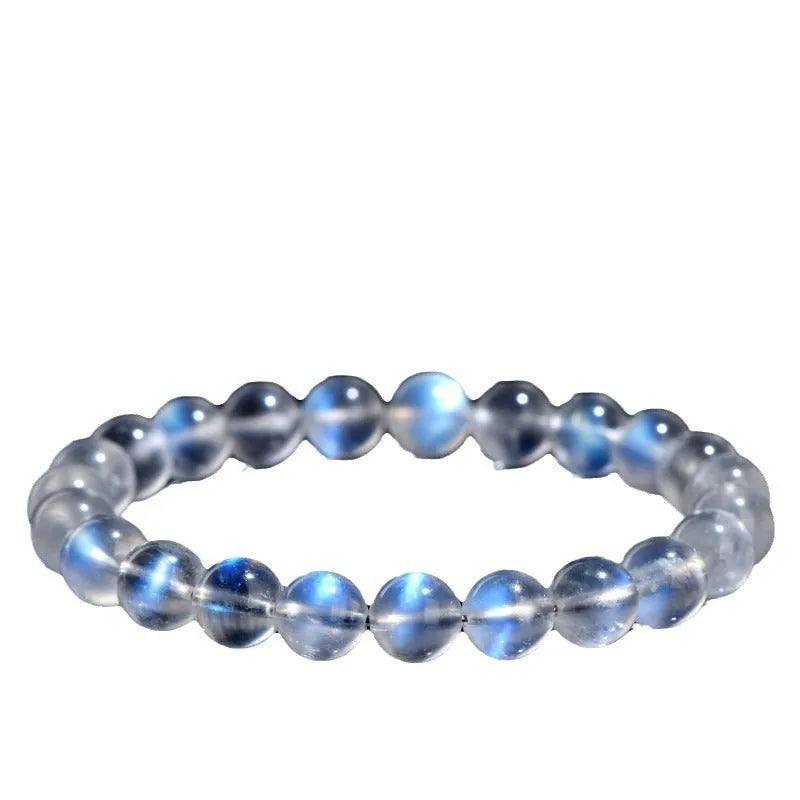 Natural cream body blue moonlight crystal bracelet on a plain background showing its size and style.