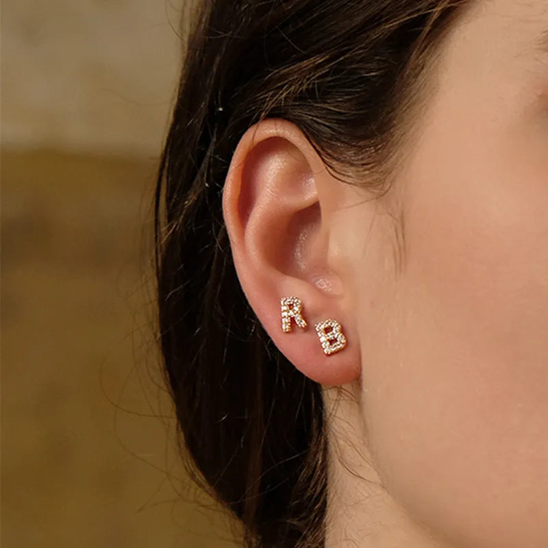 Gold plated alphabet letter earring showing a single charm on a stud or hook finding.