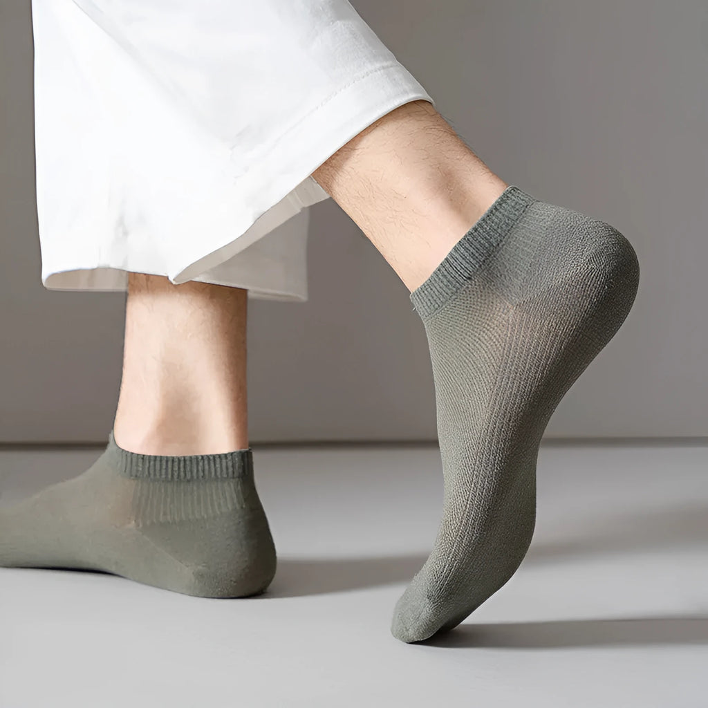 Men's solid colour low-cut polyester boat socks showing breathable fabric texture