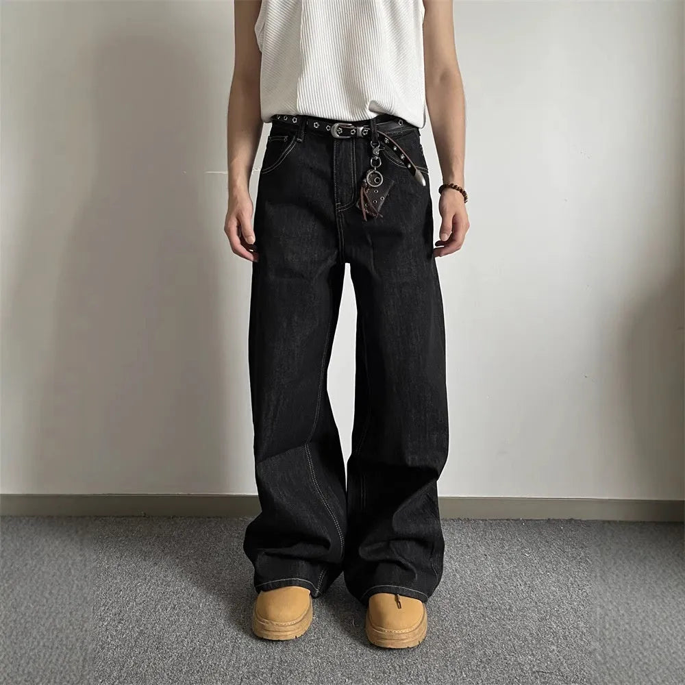 Black retro straight-leg jeans with wide-leg design on hanger