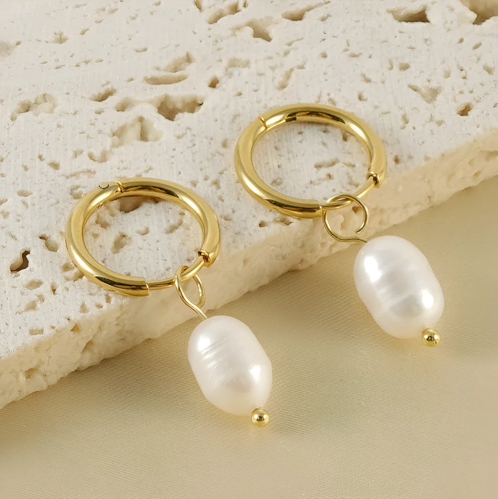 Gold-coloured geometric drop earrings with pearl accents on stainless steel for women