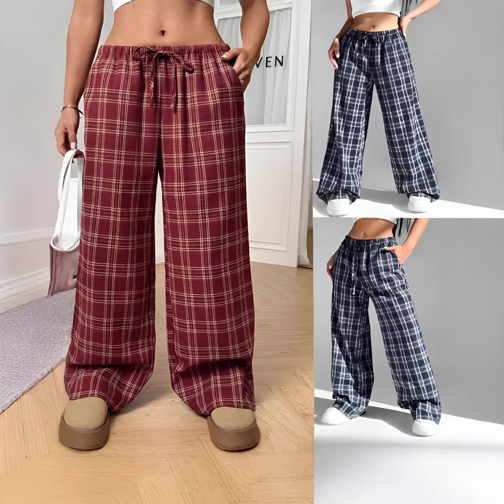 Women's red plaid casual trousers with drawstring waist and side pockets laid flat