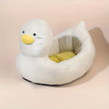 Blue duck-shaped fluffy pet bed sofa for small dogs and cats on wooden floor