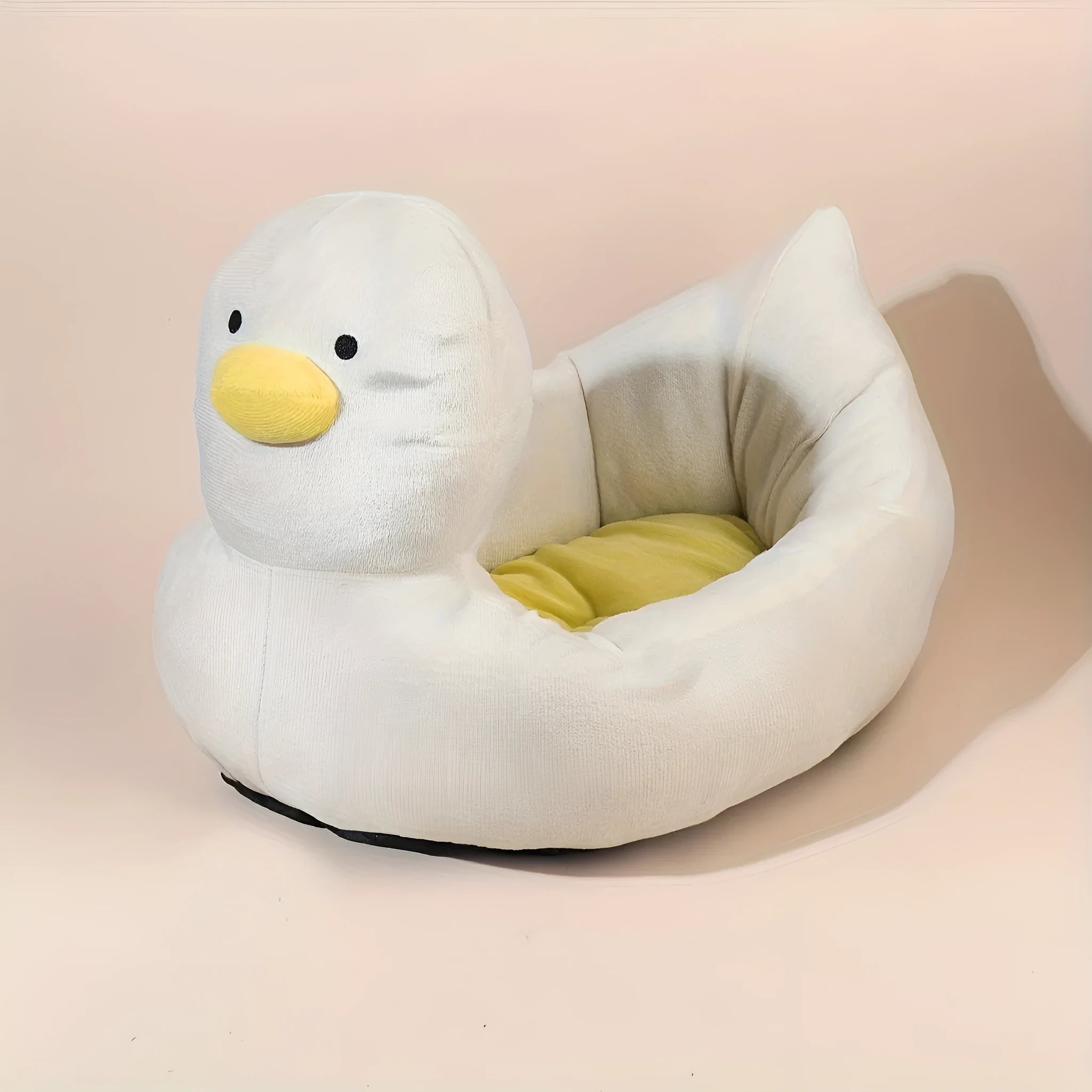 Blue duck-shaped fluffy pet bed sofa for small dogs and cats on wooden floor