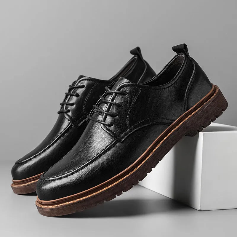 Men's tooling casual leather shoes in black, round toe low top with stitching details on rubber sole