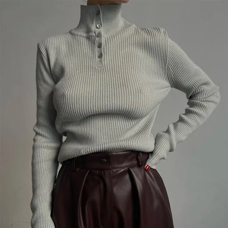 Women's silver grey slim fit pullover sweater with a single-breasted half turtleneck neckline detail.