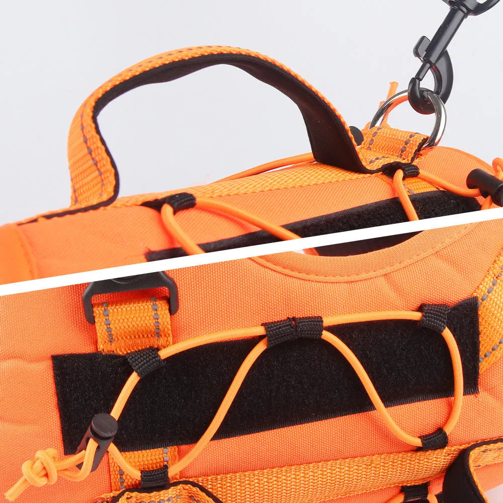 Reflective orange dog harness with a black hand-holding rope lead laid out flat.