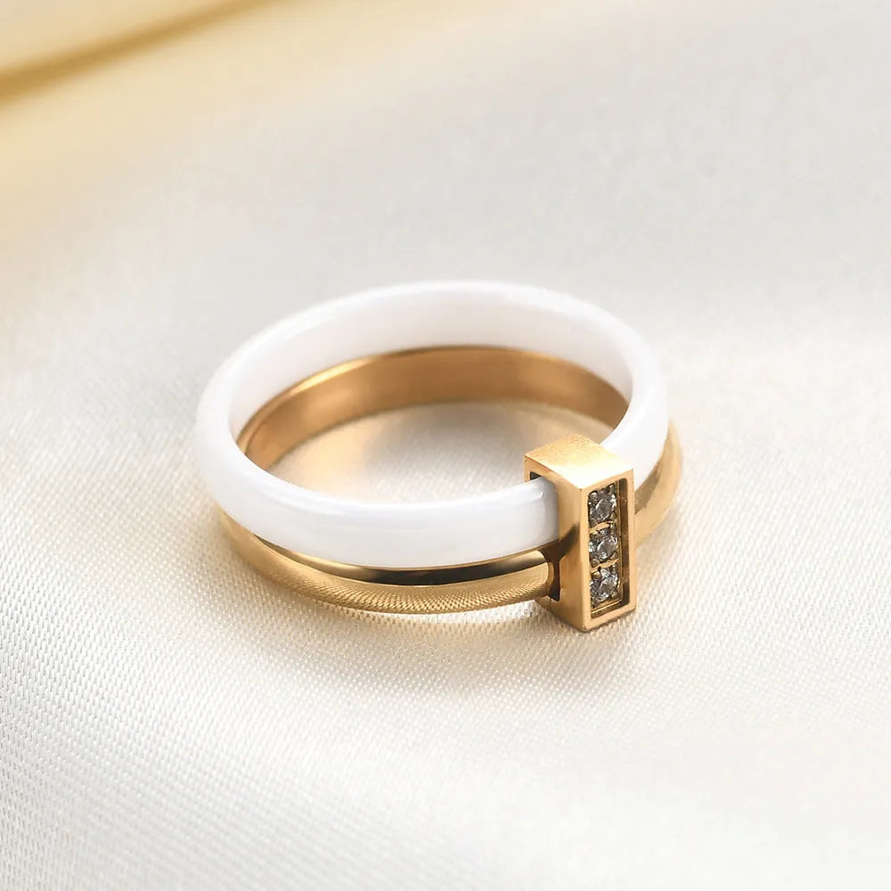 Glossy ceramic ring with zirconium stitching in geometric round shape, steel black colour option