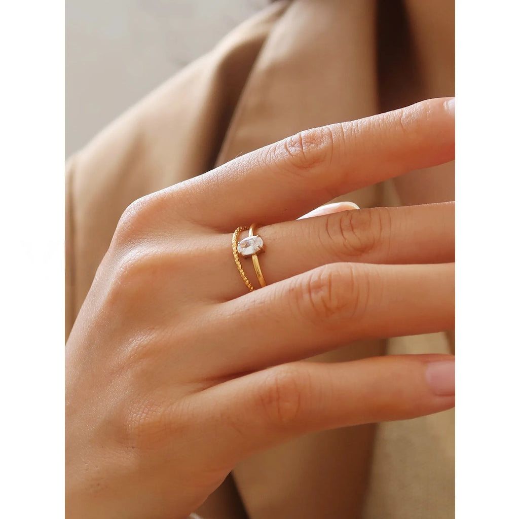 Golden heart shape stainless steel ring with electroplated finish on female hand
