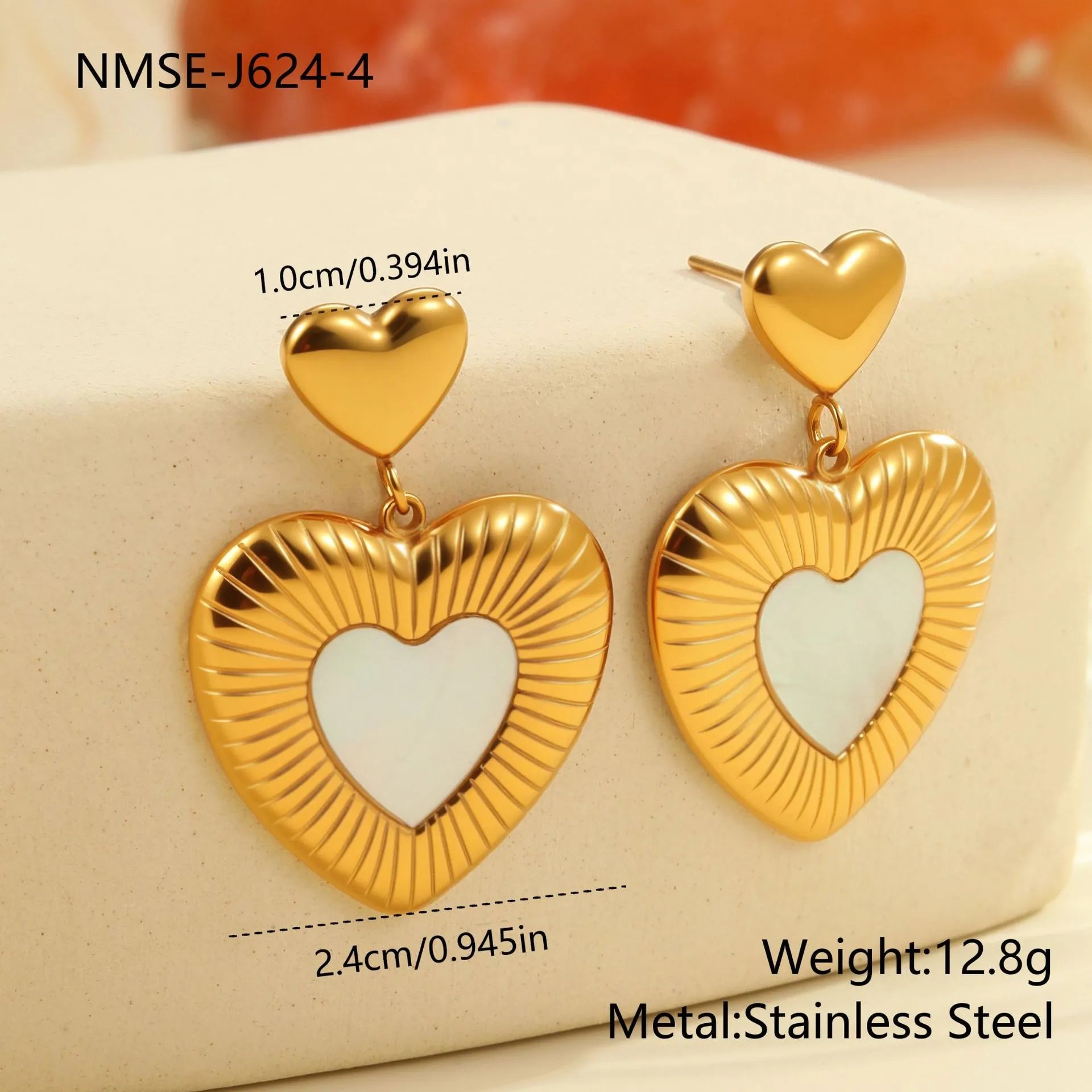 Gold electroplated heart-shaped earrings with white fritillary pattern on stainless steel