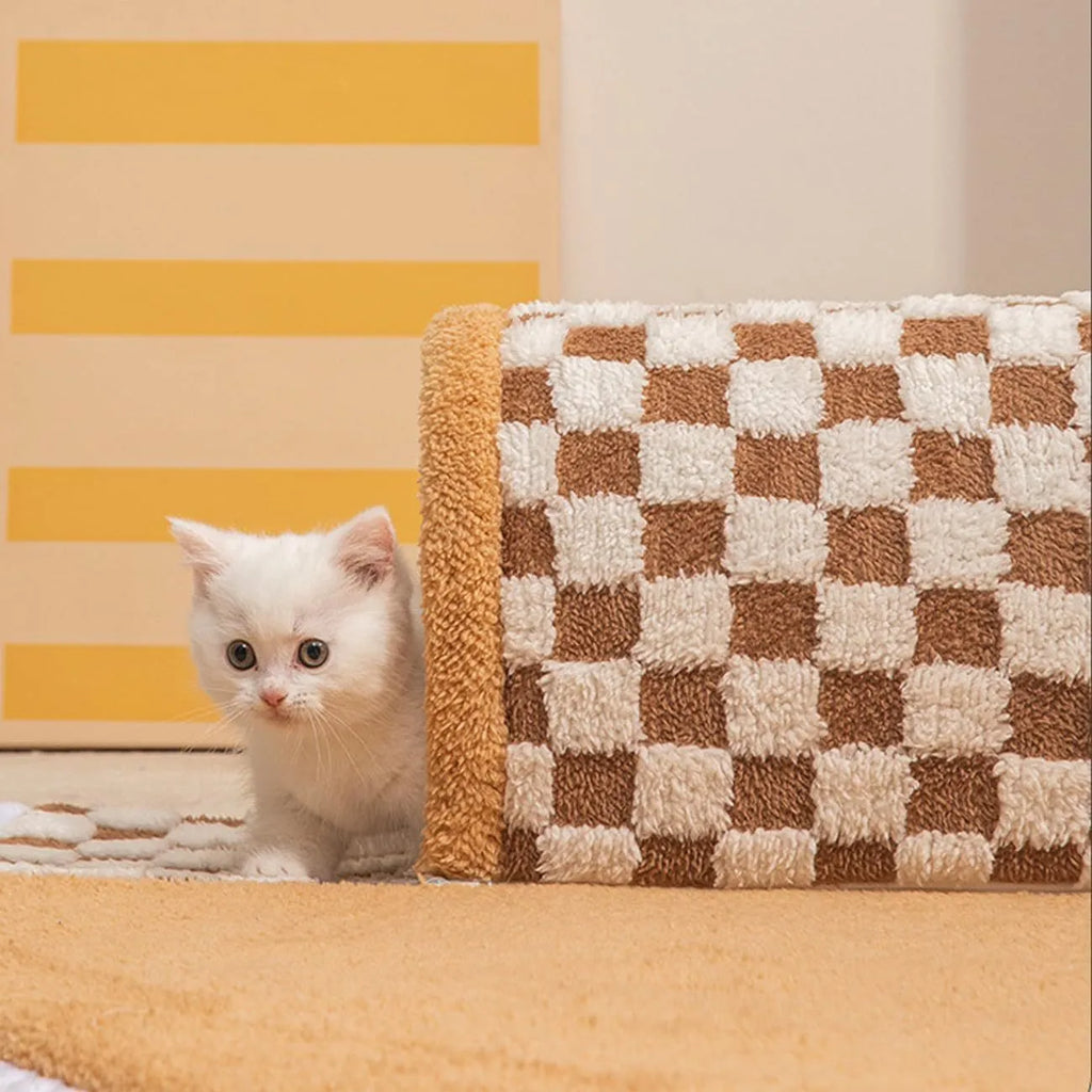 Coffee-coloured plush pet bed with attached tunnel showing soft sleeping area and play space