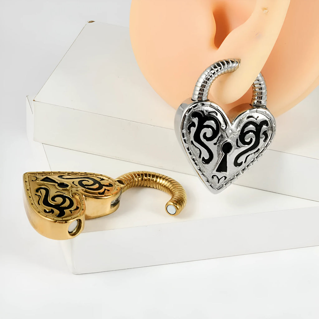 Heart-shaped stainless steel earring in steel colour close-up showing electroplated finish.