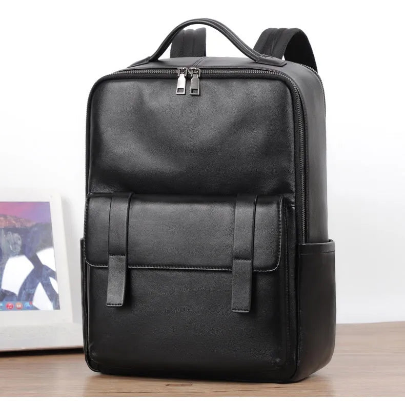 Large black genuine leather men's computer backpack with back support plate.