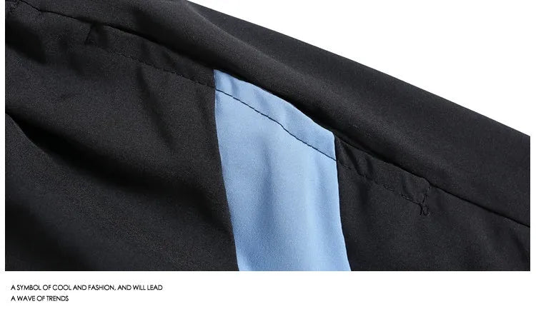 Men's black and grey quick-drying sports shorts with elastic waist and contrast colour panels for training