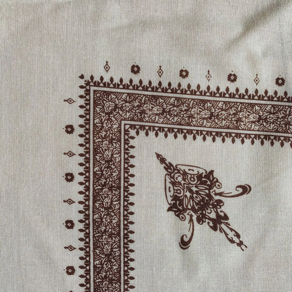 Printed square scarf in brown, 138x138cm polyester unisex scarf laid flat showing square shape and colour.