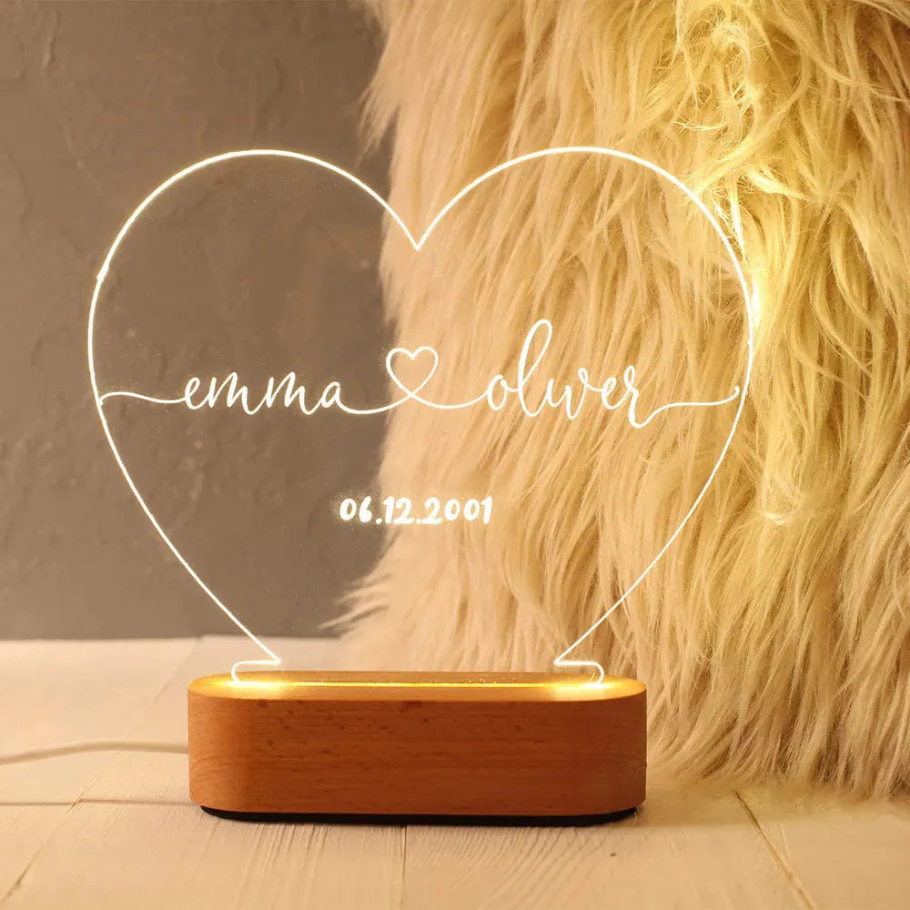 Custom acrylic LED night light with personalised names and dates illuminated