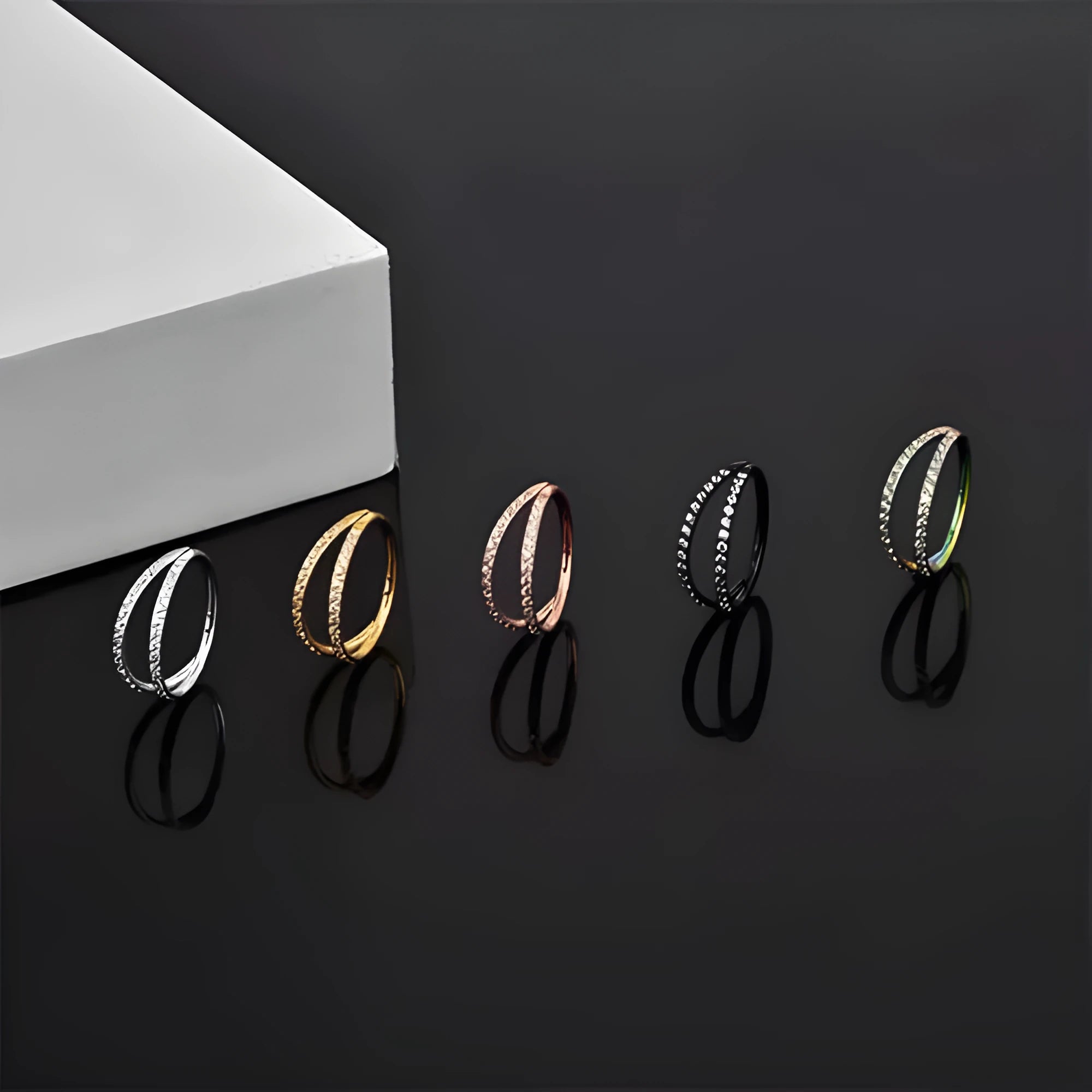 G23 titanium alloy puncture-style lip and nose ring in steel colour or gold finish.