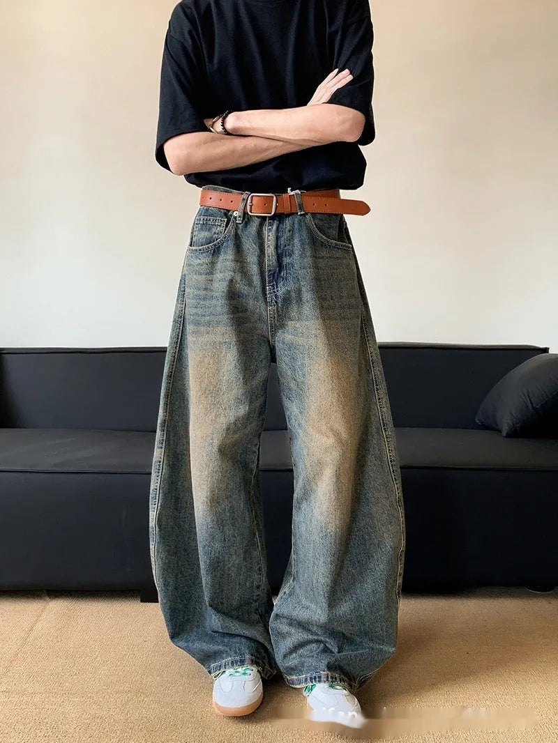 Men's retro blue distressed denim wide-leg pants with vintage styling and slimming silhouette
