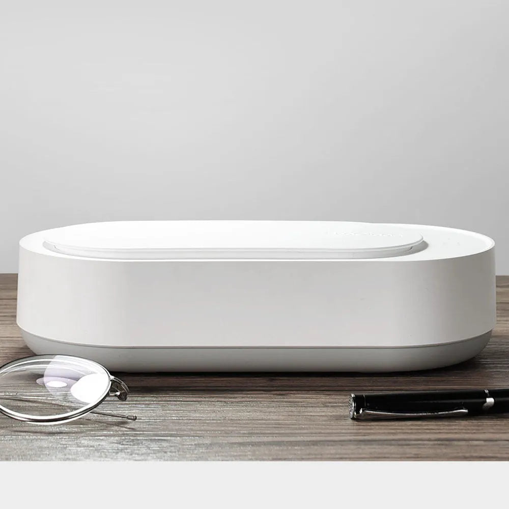 White portable ultrasonic cleaning machine with touch button and stainless steel tank.