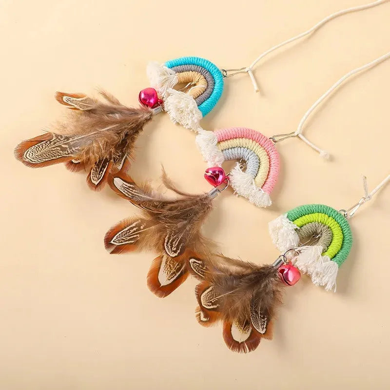Cat toy with feather rope hanging from door using elastic and sticky buckle clamp, available in Blue, Green, and Pink