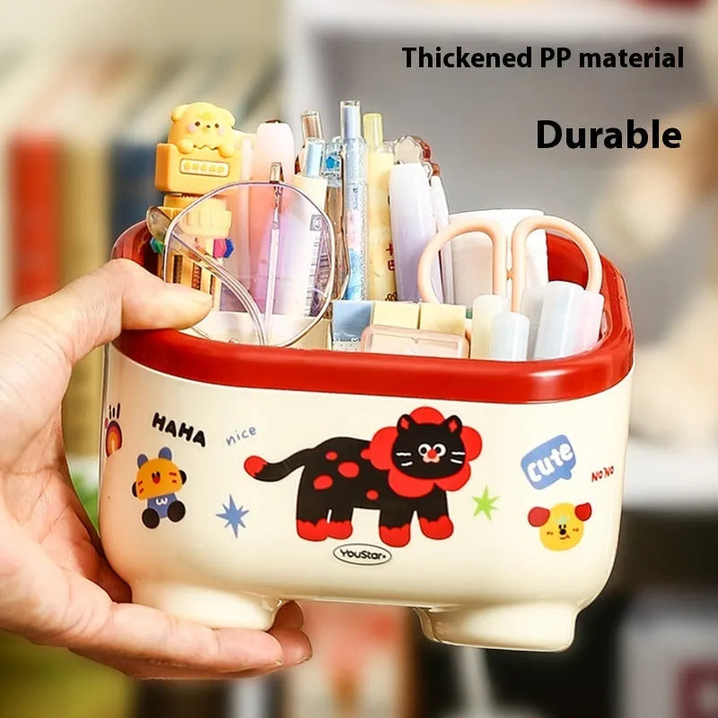 Cartoon-style plastic desktop organiser set with multiple boxes, pen holder, and 2L capacity on a desk.