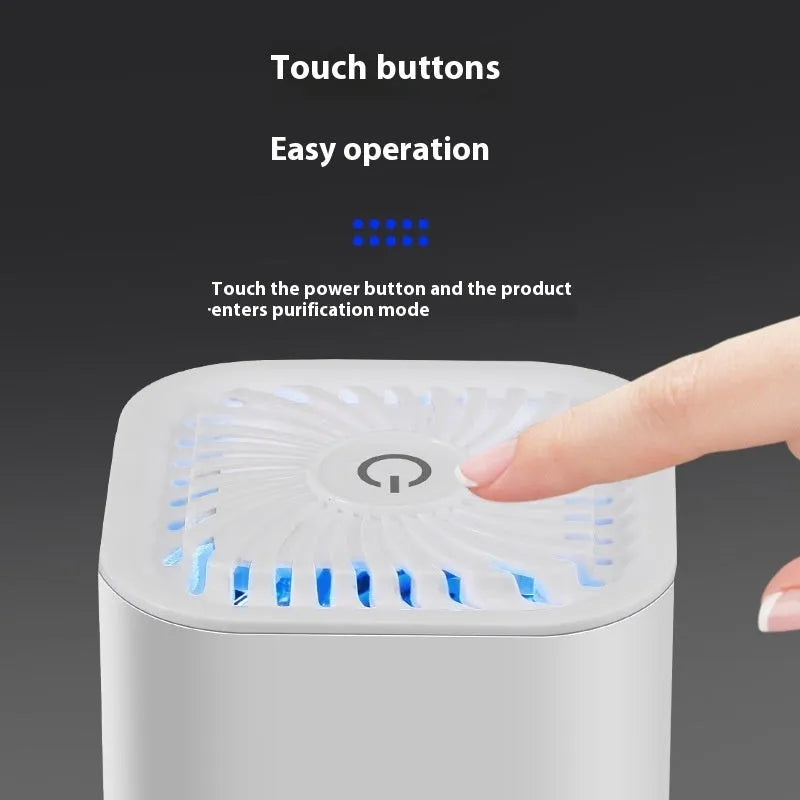 Compact black and white mini USB car air purifier with filter for small spaces.