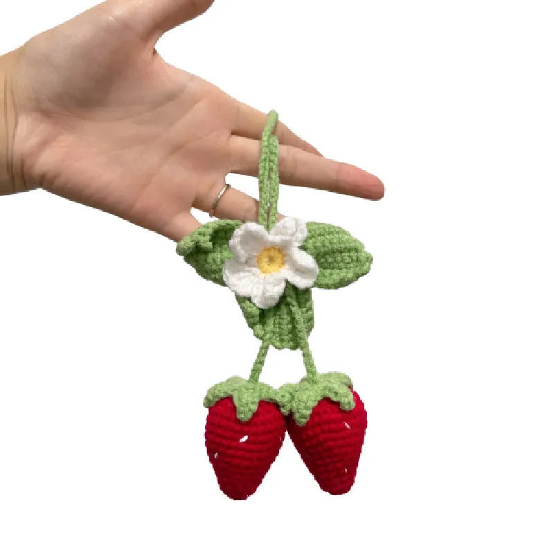Handwoven strawberry-shaped car pendant made from natural cotton and hemp fibres.