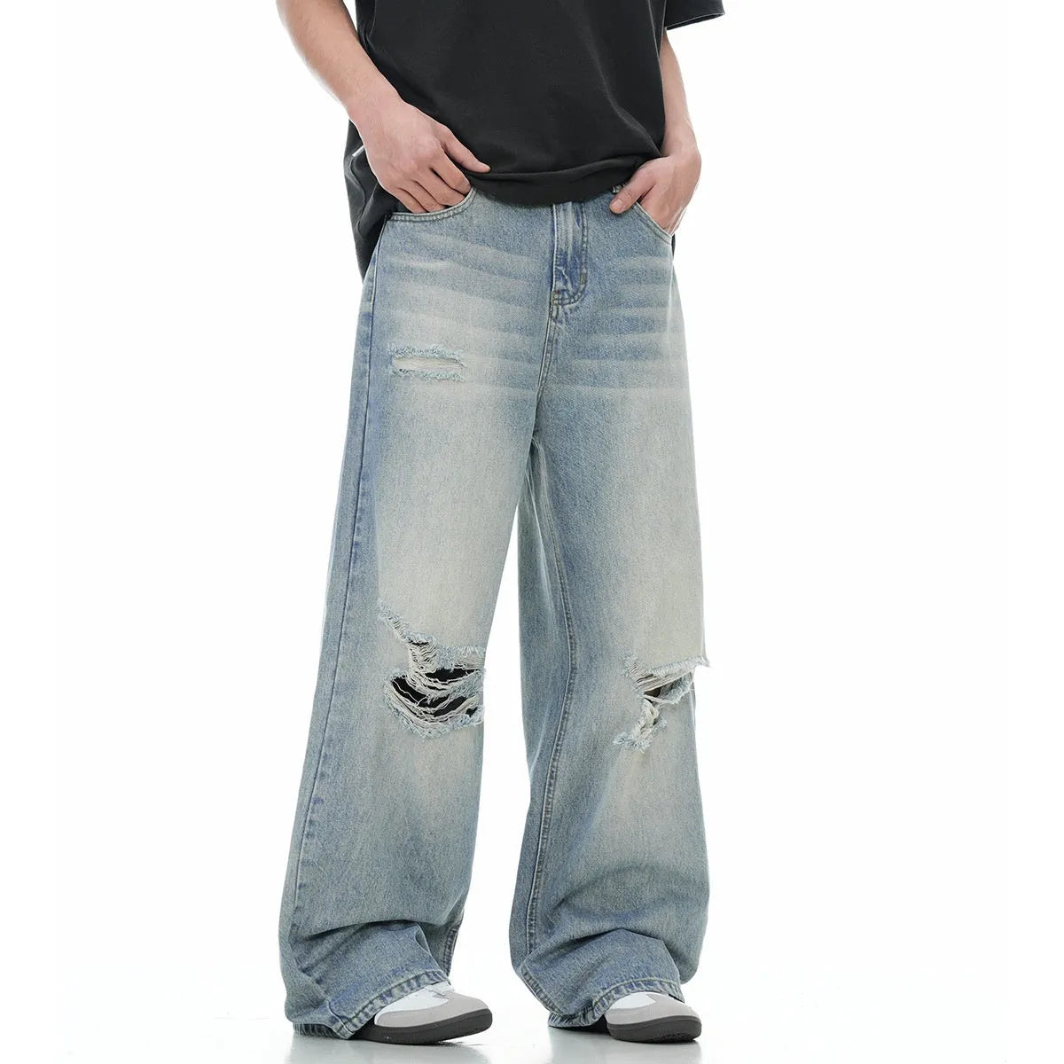 Blue men's retro straight-leg jeans with ripped details and a zipper fly.